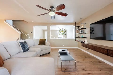 Spacious Living room with 65'' TV, perfect for enjoying your favorite game/show.