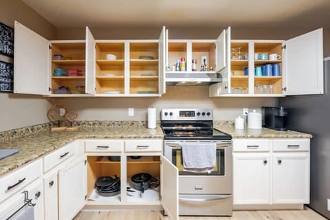 Large kitchen stocked with kitchenware.  Includes complimentary coffee and tea. 