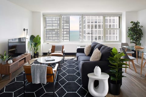 Open living room and dining space with lake views and great light