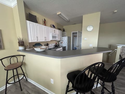 Laundry room is through the open door. 
Kitchen is fully stocked.