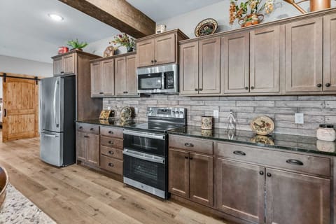 All stainless appliances, two refridgerators, two dishwashers, and all Cuisinart kitchen gadgets.