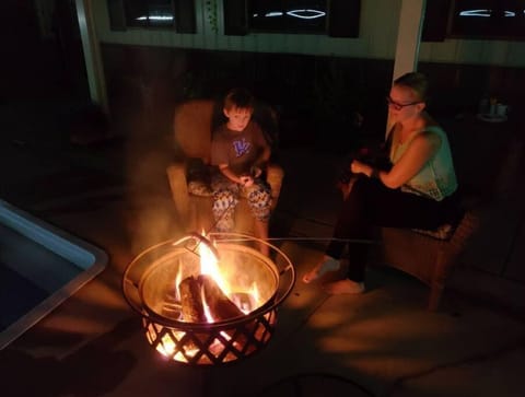 Camper has it's own firepit too.  Firewood provided no additional charge