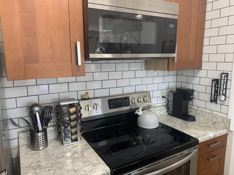 Keurig coffee maker & coffee is supplied.