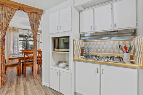 Five burner gas stovetop and microwave to prepare your meals. (There is no oven)