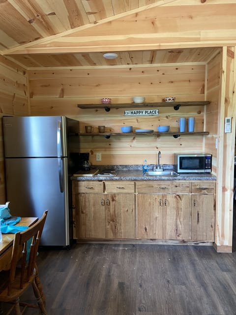 full size refrigerator, 4 burner stove top, toaster, coffee pot, microwave