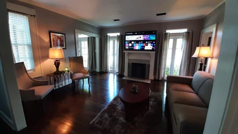 Open concept living room and dining room with 65" Smart TV