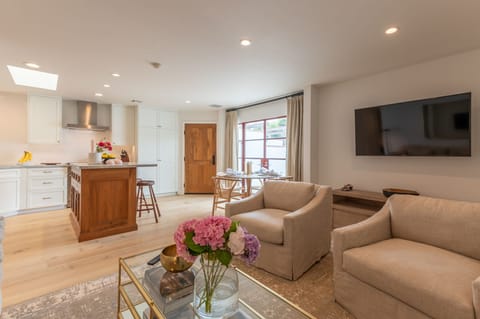 Open concept living with large screen internet TV. 