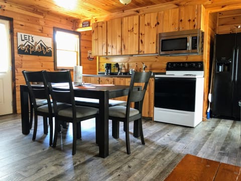 Dining and kitchen area, full size refrigerator with ice/water in door