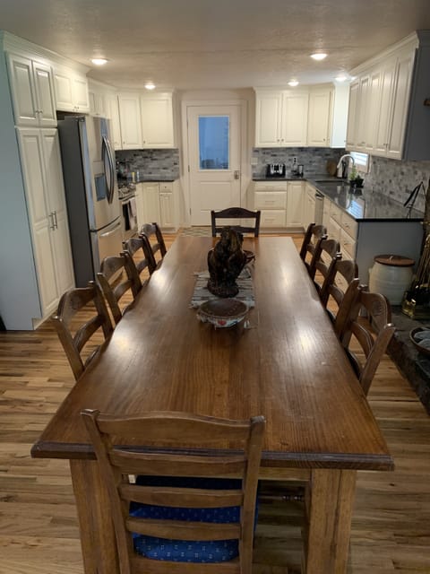Dining Table with kitchen in background.