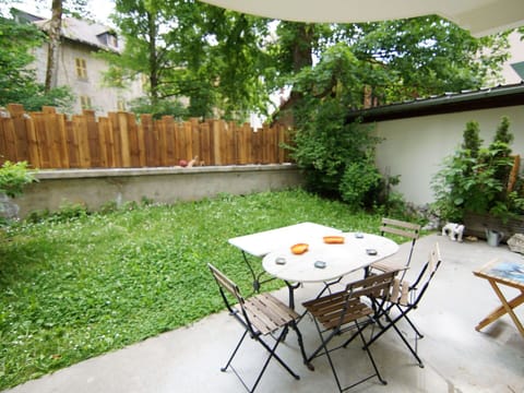 Plant, Furniture, Property, Table, Chair, Tree, Wood, Building, Fence, Grass