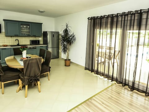 Furniture, Property, Building, Table, Black, Chair, Picture Frame, Interior Design, Houseplant, Wood