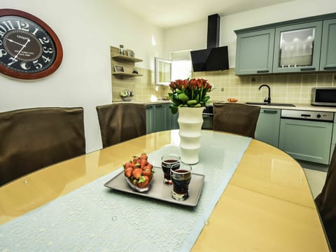 Table, Furniture, Tableware, Food, Plant, Cabinetry, Countertop, Kitchen Appliance, Architecture, Picture Frame