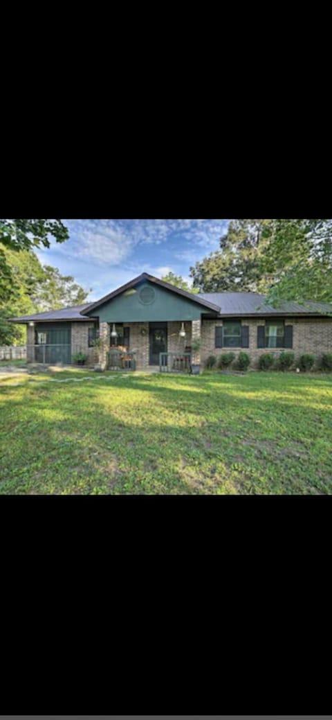 Front yard with a fence for children or animals. 