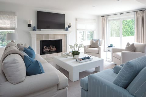 Living Room w/ new TV and gas fireplace.   Slider opens to backyard.