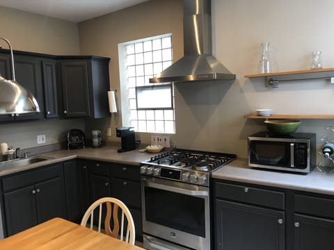 Kitchen w/ stainless appliances.