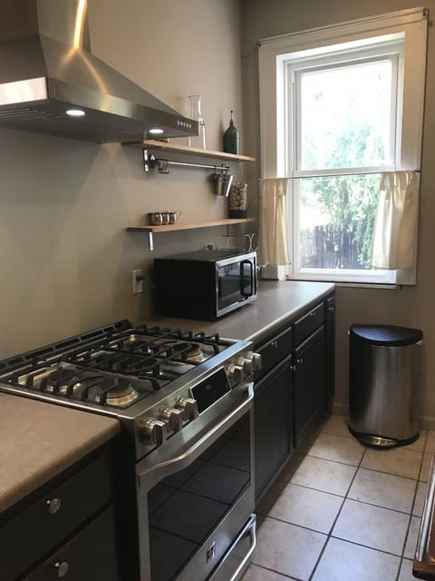 LG gas range/stove w/ vent hood.