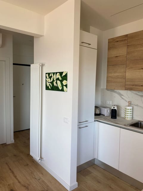 Full kitchen with stove top, oven, microwave, dish washer and washing machine. 