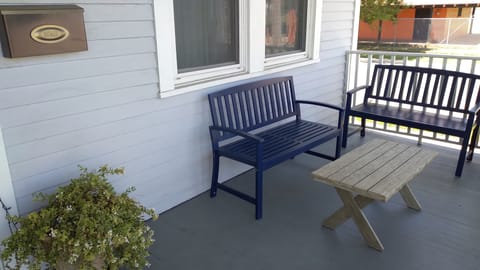 Our front porch is a place for morning coffee and shelter coming and going.