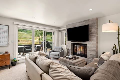 Living area, wood fireplace (wood provided). Sliders to private deck/mtn view