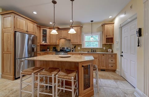 Kitchen with counter seating for 4- door on the right to garage