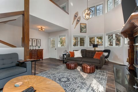 A spacious living room with 20' ceilings provides a large open environment.