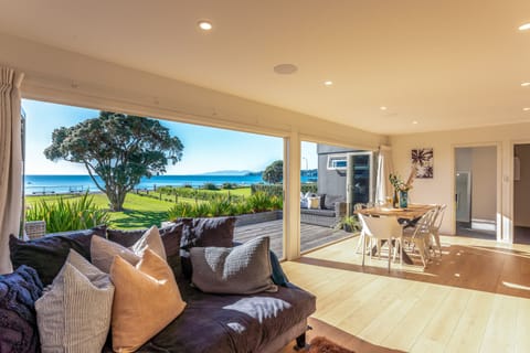 Open plan living and dining onto large Deck with seaview