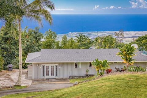 The house is located on the lower 1 1/2 acres surrounded by a large grass area. 