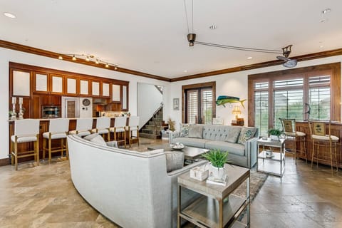 Living area is open to the kitchen and dining room and features plenty of bar seating