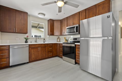 Cottage 1 Full-sized kitchen, dishwasher, stove and refrigerator.