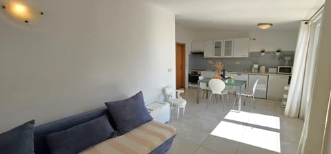 Apt Blue open plan living / dining area with kitchen