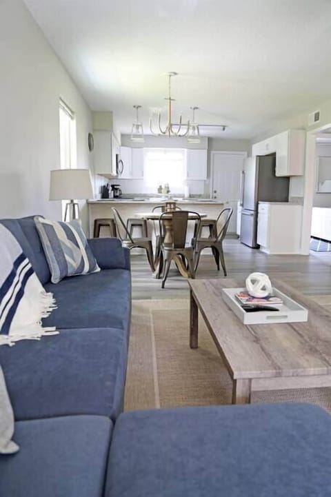 Spacious, open-concept design seamlessly connecting the living room and kitchen for a bright and airy feel.