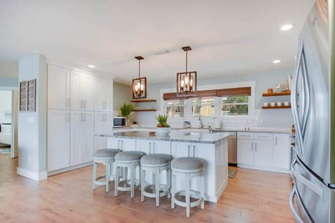 Stunning kitchen with large island with bar seating. Fully stocked.
