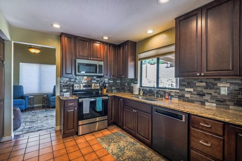 Kitchen view 2 with dishwasher, oven, and microwave. Mountain view from sink.