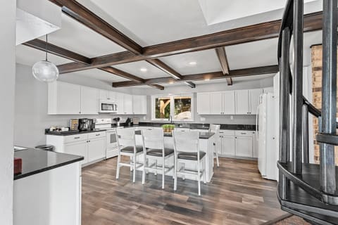 The kitchen’s open design encourages togetherness, making cooking a part of the entertainment.