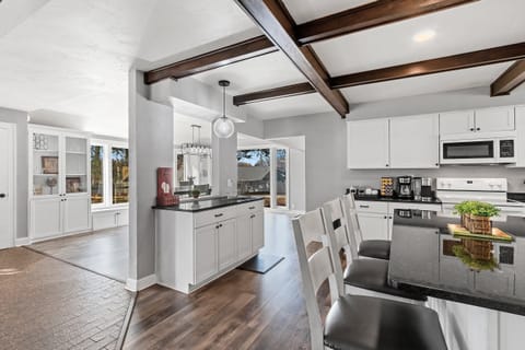 Experience the blend of modern amenities and communal warmth in our kitchen, your hub for culinary exploration.