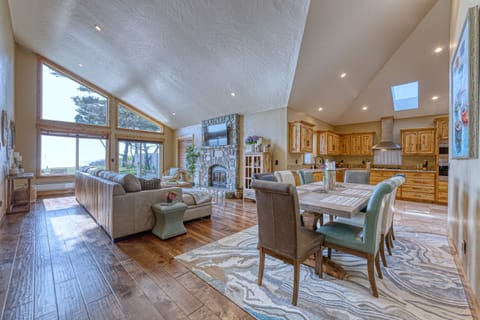 Open space Livingroom, dining area and kitchen.  Amazing views and fireplace.