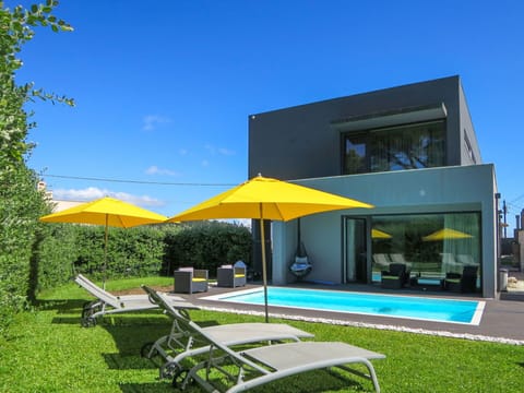 Sky, Property, Plant, Building, Shade, Window, Outdoor Furniture, Swimming Pool, House, Rectangle
