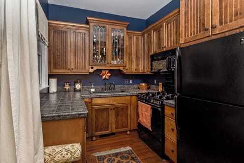 Full kitchen with gas stove, microwave and dishwasher.