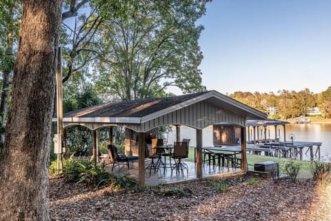 Covered pavilion with brick fireplace/grill.