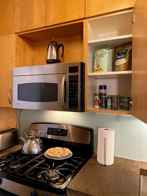 Full size appliances including gas range, oven, and microwave oven.