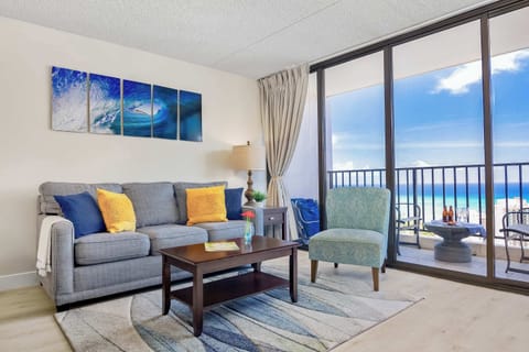 Pull-out sleeper sofa, accent chair, and coffee table in the living room.