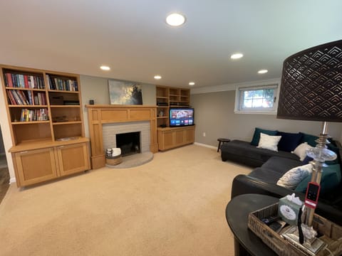 Spacious living room in the daylight basement with Apple TV