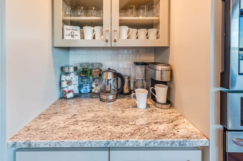 Coffee bar with Kuerig, tea kettle, and complimentary k-cups for the whole stay.