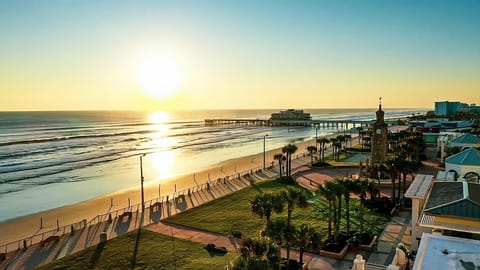 Soak up golden sunsets while the shoreline glows below.
