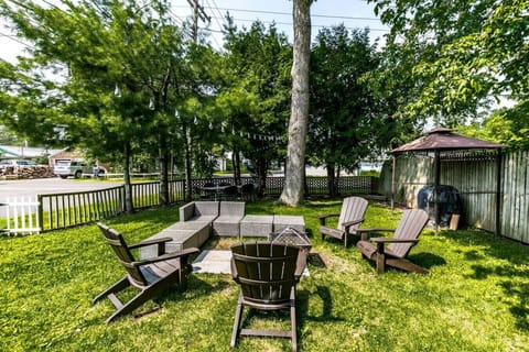 A cozy backyard oasis, perfect for relaxing with friends and family on a warm evening.