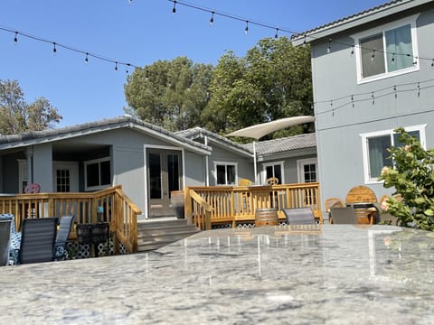 A view looking towards the house from the barbecue and patio area.