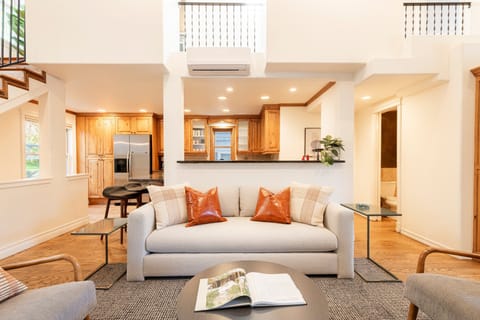 Living Room with 48" Smart TV, gas fireplace, plush furnishings, and Private BBQ patio access