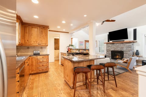 Fully Equipped Modern Kitchen with Stainless Steel Appliances, Gas Range - Open to the Living Room