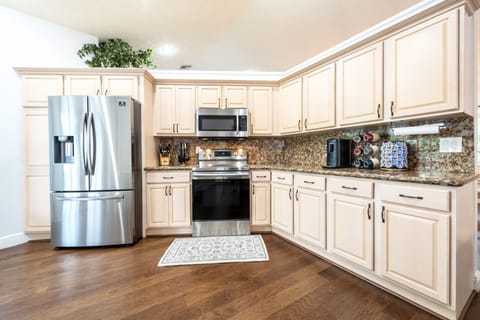 Gourmet kitchen with Stainless Steel appliances.