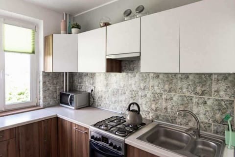  The kitchen's bright space is perfect for preparing meals. 